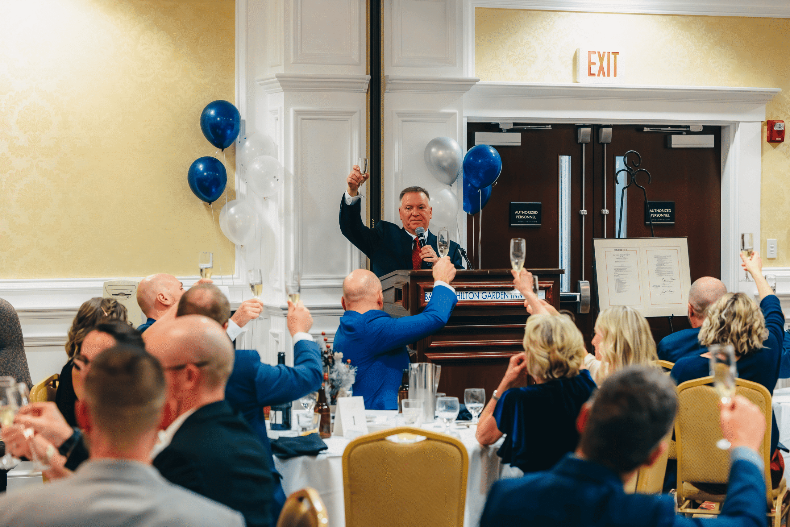 Founder and CEO Jim Rogers leads a toast during ProInfoNet’s 30th anniversary celebration in Bangor.